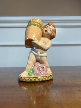 Mid century girl holding urn figural planter